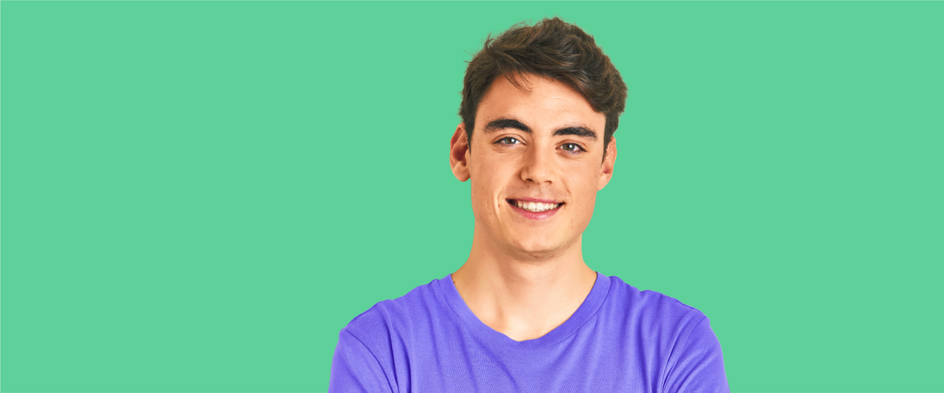 Young male teen with visible acne smiling confidently towards camera.
