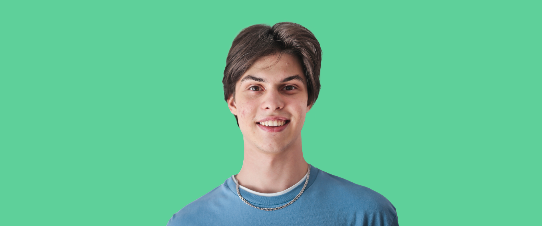 Young male teen holding the CareConnect card up in front of his face toward the camera.