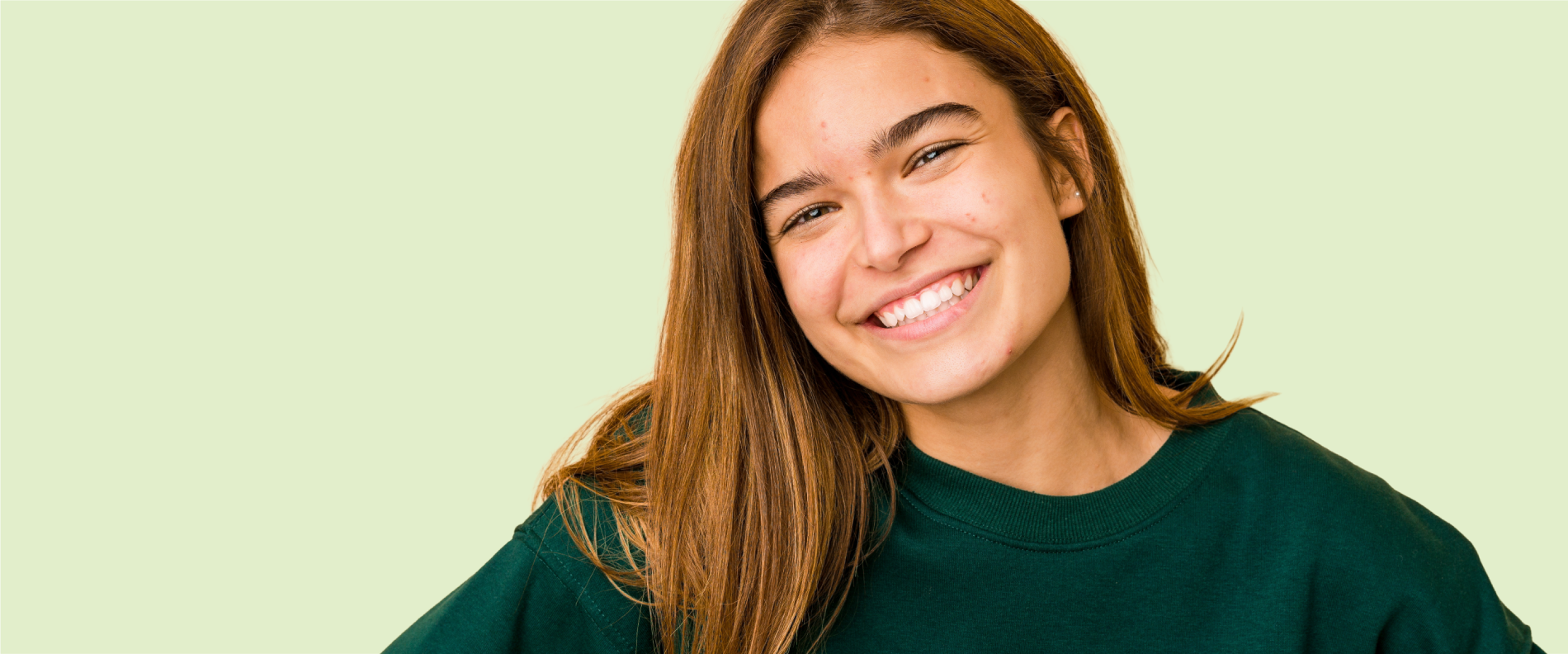 A close-up photo of a person smiling.